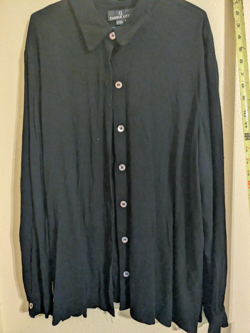 Black top with shell buttons.